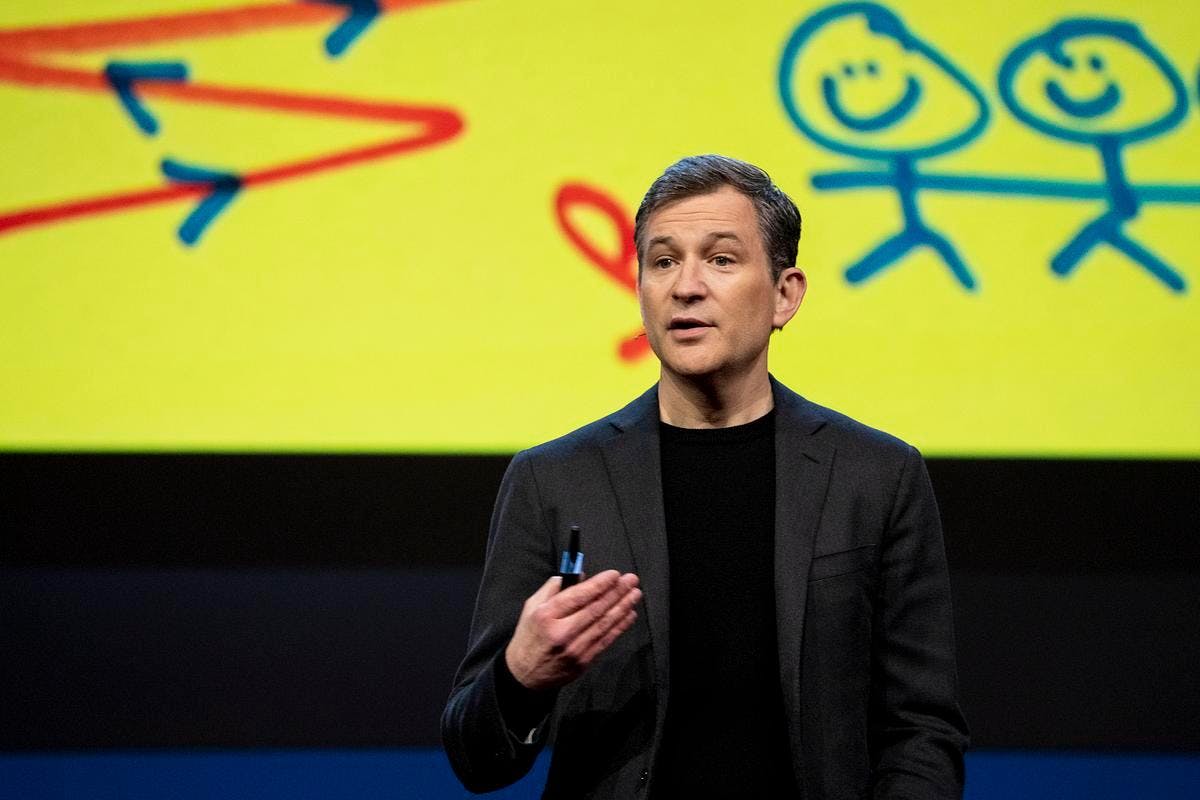 Dan Harris, a middle-aged white man, on stage giving a talk at the TED conference